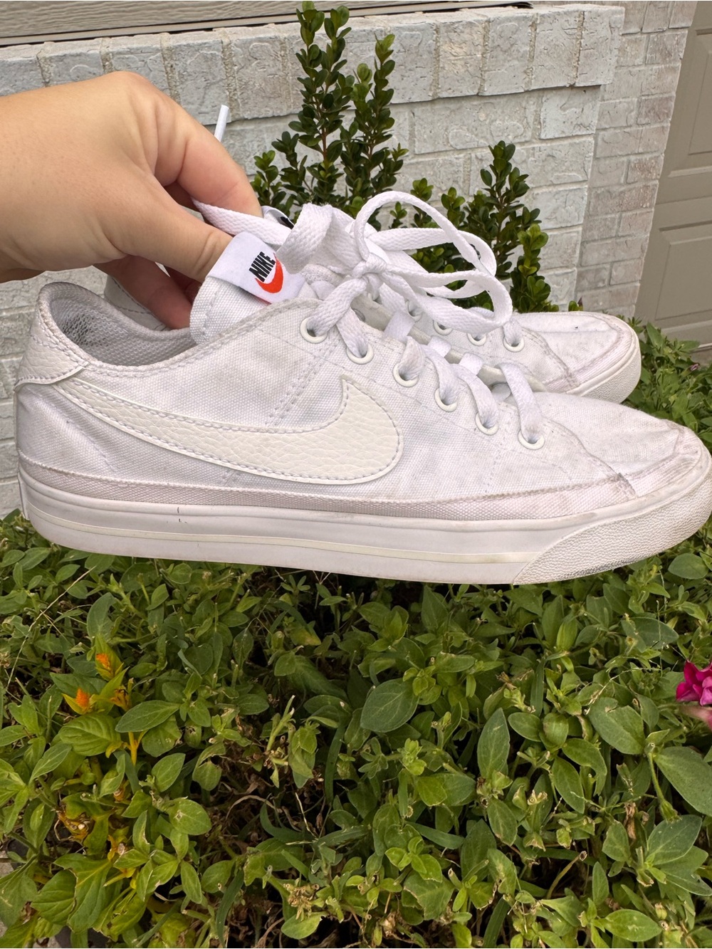Nike Womenβs White Low-Top Canvas Sneakers